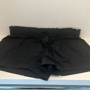 Black high rise athletic shorts.